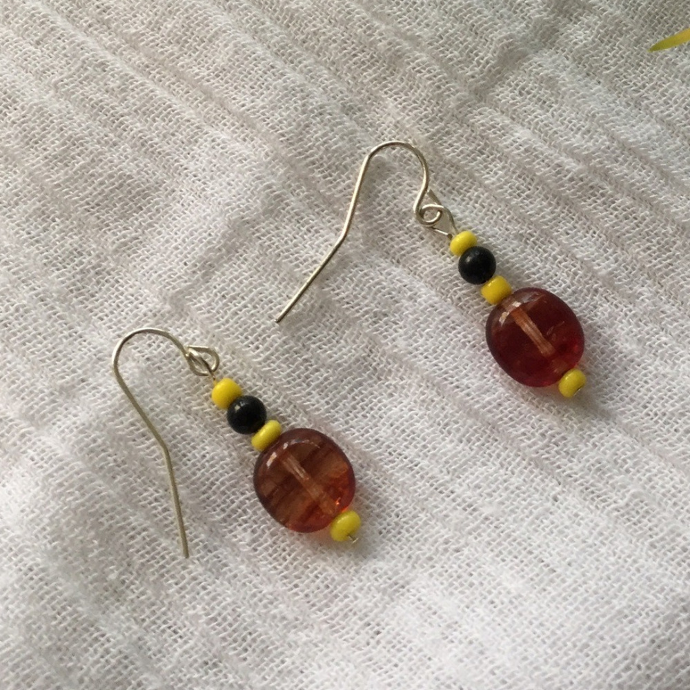 Tiny amber glass dangle earrings